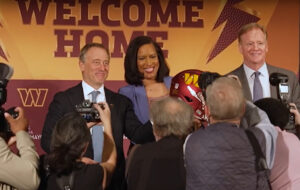 Commanders' principal owner Josh Harris and DC Mayor Muriel Bowser at the stadium press conference. YouTube: @WashingtonPost.